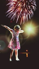 Rear view of girl with umbrella