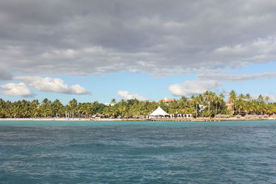 Scenic view of sea by building against sky