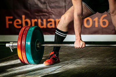 Athlete exercise deadlift barbell weighing 220 kg