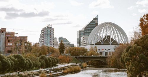 View of buildings against cloudy sky