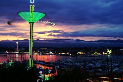 View of illuminated street light against cloudy sky