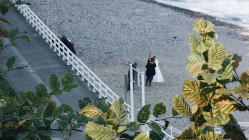 High angle view of people standing by railing