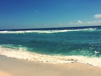 Scenic view of sea against blue sky