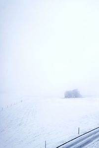 Scenic view of snow field against clear sky