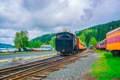 Train on railroad track against sky