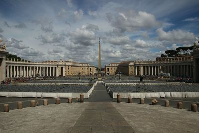 St. peter's square against cloudy sky