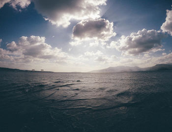 Scenic view of sea against cloudy sky