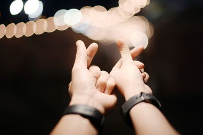 Close-up of hands against blurred background