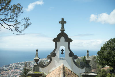 Panoramic shot of building by sea against sky