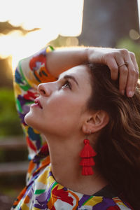 Portrait of young woman looking away