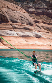 Full length of man surfing in sea