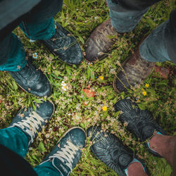 Low section of people standing on land