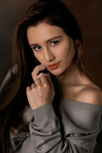 Portrait of beautiful young woman with long hair