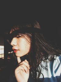 Portrait of young woman looking away