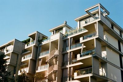 Low angle view of building against clear blue sky