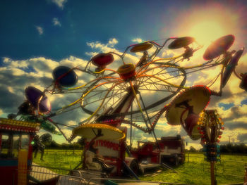 Illuminated lights against sky