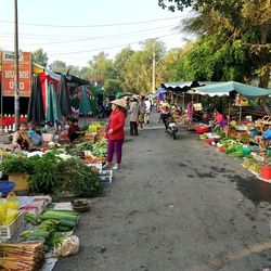 Group of people at market stall