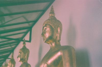 Low angle view of statue against building