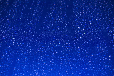 Close up of blue water drops