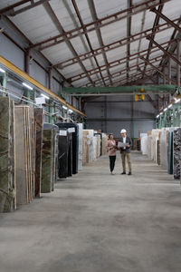 Architects working in marble warehouse