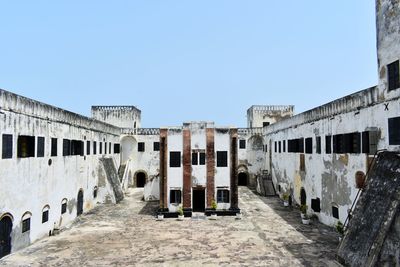 View of old buildings against clear sky