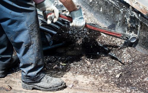 Low section of man working in water