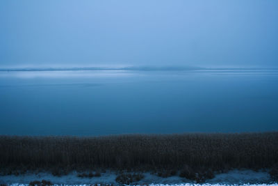 Scenic view of sea against sky during winter