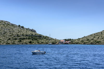 Scenic view of sea against clear blue sky