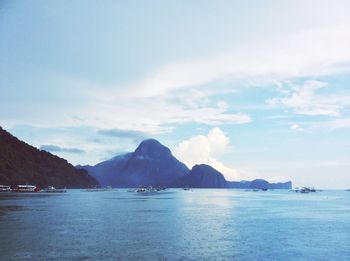 Scenic view of sea against cloudy sky