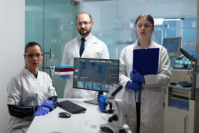 Portrait of scientists standing in laboratory