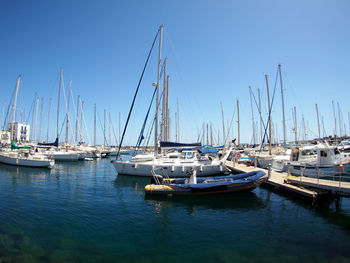 Boats moored at harbor