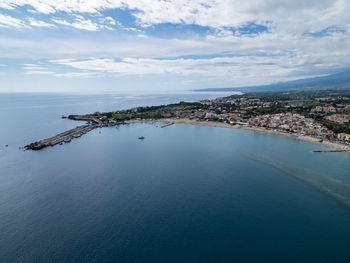 Aerial view of sicilian east coast against overcast sky