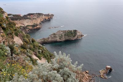 High angle view of rocks on sea