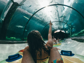 Portrait of young woman swimming in pool