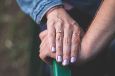 Midsection of couple hands