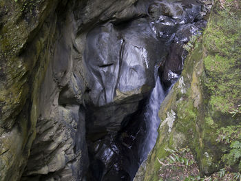 Close-up of water flowing through rocks