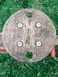 Close-up of old wooden fence on grassy field