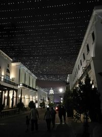 Low angle view of illuminated building at night