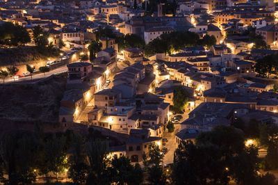 High angle view of houses in town at night