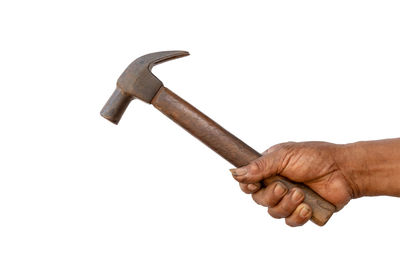 Close-up of man holding hands against white background