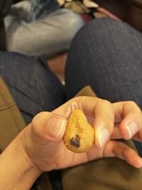 High angle view of hand holding cookies