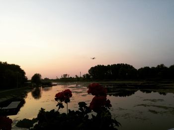 Scenic view of lake against sky during sunset