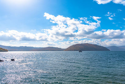 Scenic view of sea against blue sky