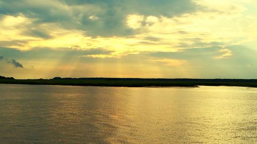 Scenic view of sea at sunset