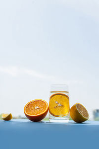 Various fruits on table against white background