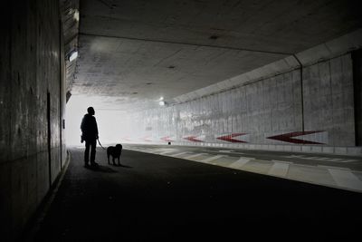 Silhouette of man in tunnel