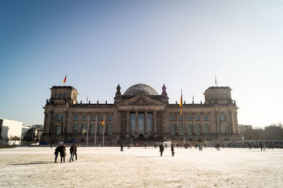 People at town square against clear sky