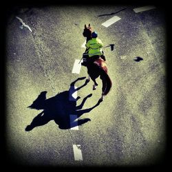 Woman cycling on road