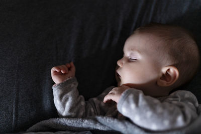 Cute baby girl sleeping on the bed