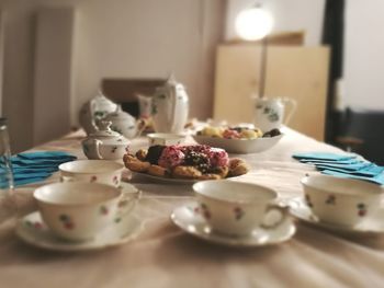 Cookies served in plate on dining table